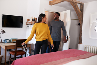 couple arriving at Airbnb room, clean and happy concept